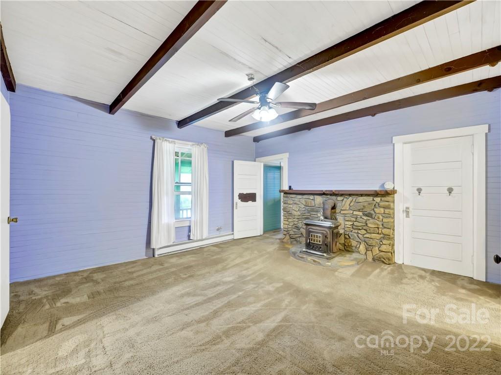 2731 Redmon Road Marshall, NC 28753 - Photo 11 of 43 a view of a livingroom with a fireplace