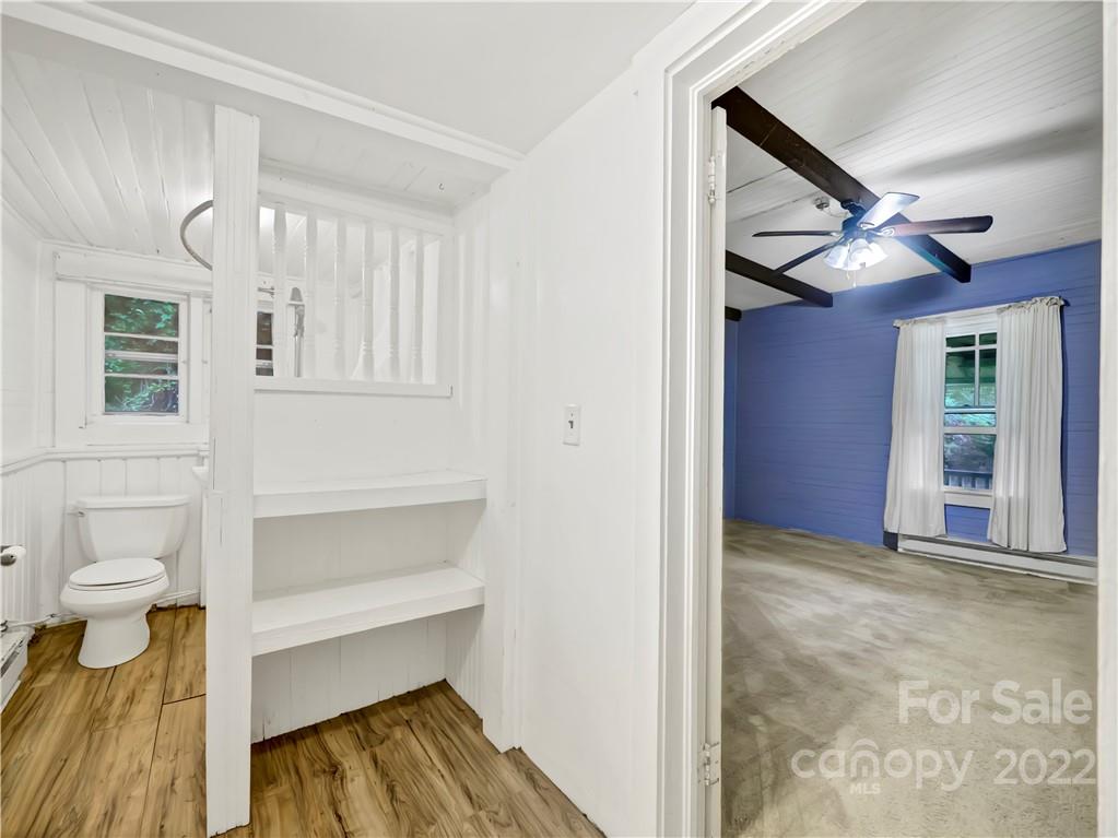 2731 Redmon Road Marshall, NC 28753 - Photo 14 of 43 a view of bedroom with a bed and ceiling fan