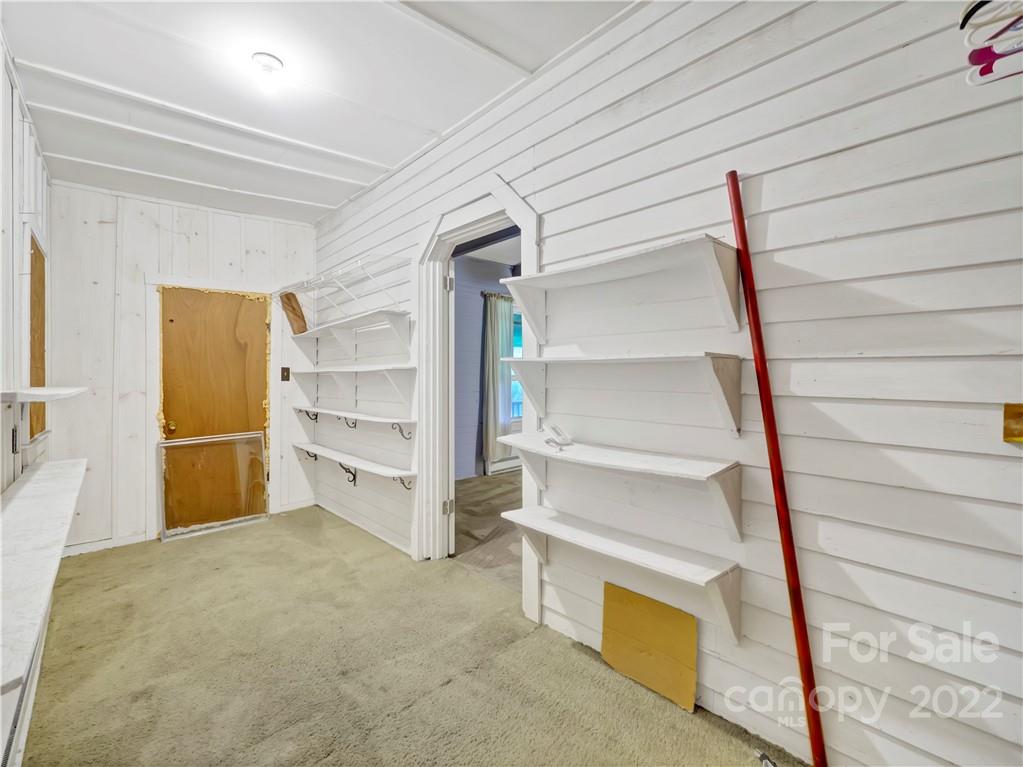 2731 Redmon Road Marshall, NC 28753 - Photo 16 of 43 a view of an empty room and stairs