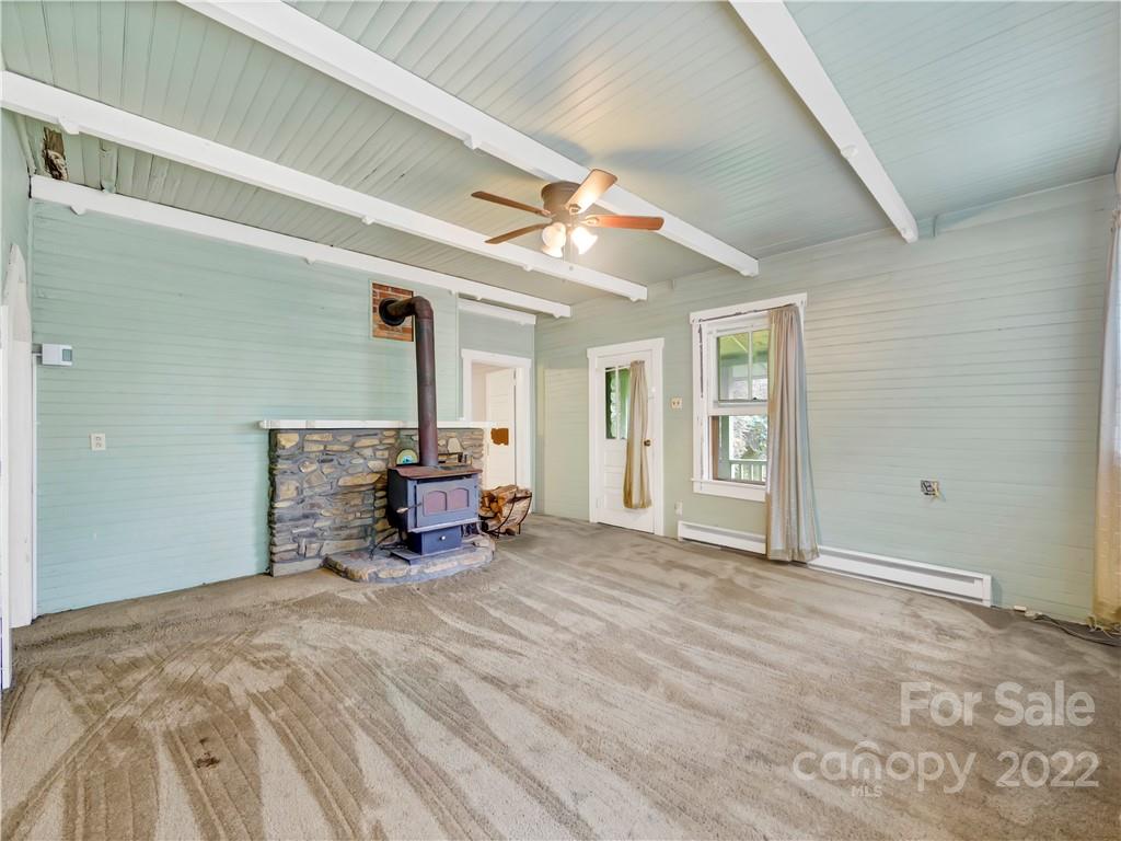2731 Redmon Road Marshall, NC 28753 - Photo 24 of 43 a bed room with a bed and a chair