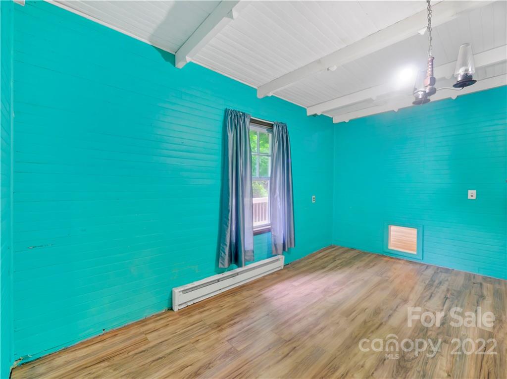 2731 Redmon Road Marshall, NC 28753 - Photo 30 of 43 a view of a big room with window and stairs