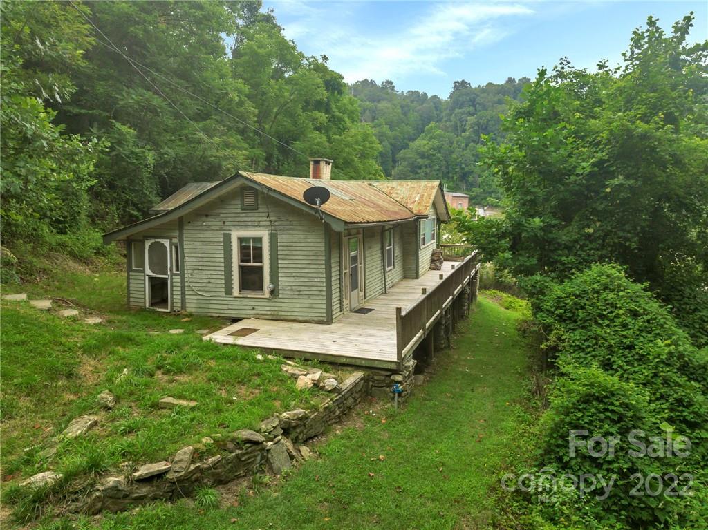 2731 Redmon Road Marshall, NC 28753 - Photo 3 of 43 a aerial view of a house with swimming pool next to a big yard