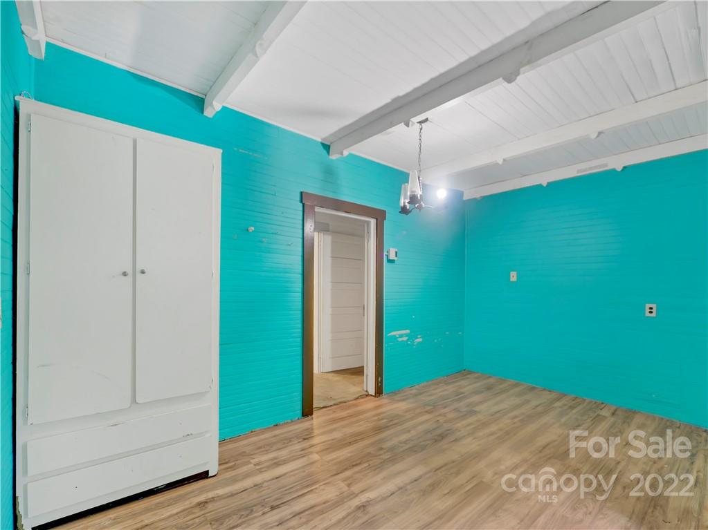 2731 Redmon Road Marshall, NC 28753 - Photo 31 of 43 a view of a room that has a bed and a plant