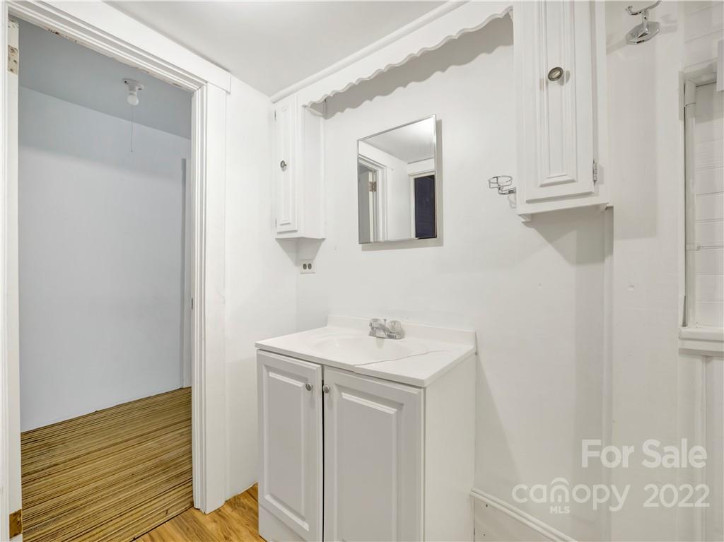 2731 Redmon Road Marshall, NC 28753 - Photo 33 of 43 a bathroom with a sink a mirror and shower