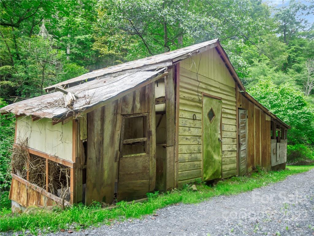 2731 Redmon Road Marshall, NC 28753 - Photo 42 of 43 a view of a house with a yard
