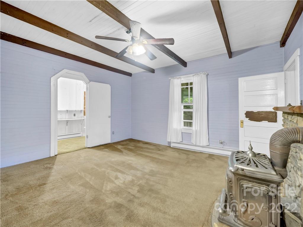2731 Redmon Road Marshall, NC 28753 - Photo 7 of 43 a view of an empty room with a window