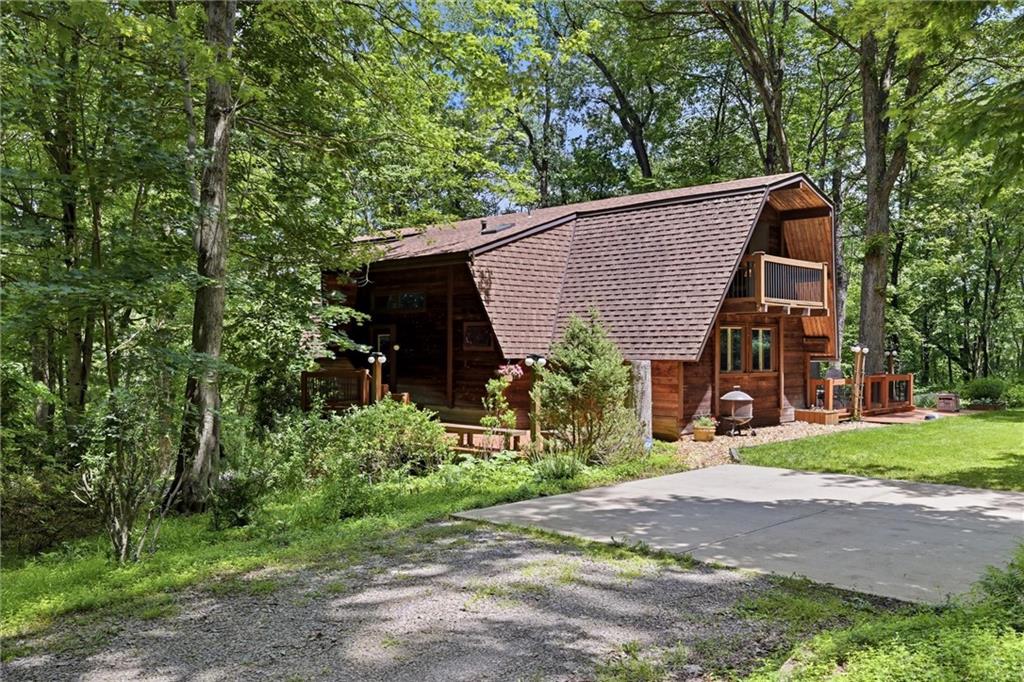 6110 Saltsburg Road Murrysville, PA 15668 - Photo 35 of 47 a front view of a house with garden