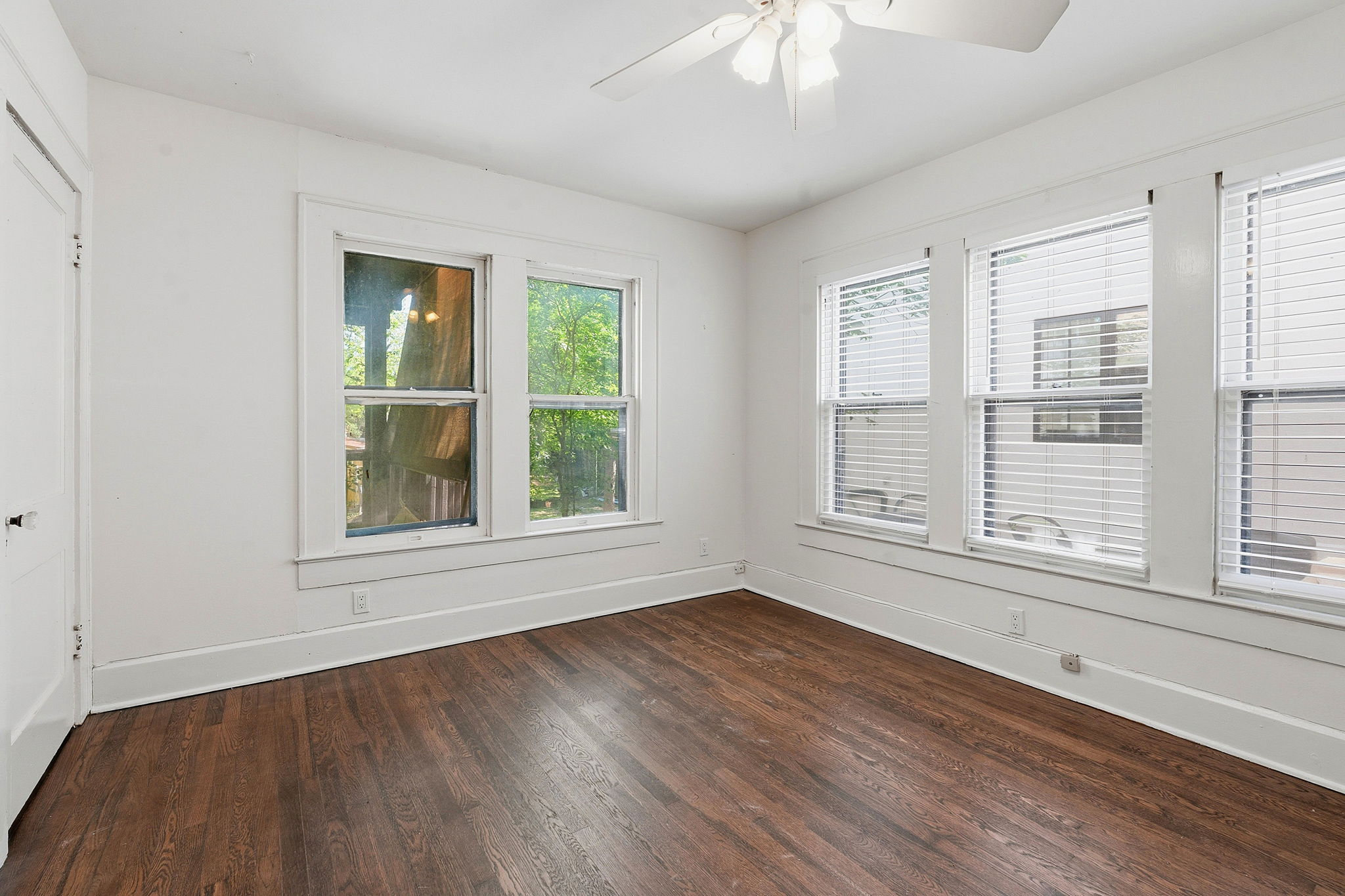 804 Rutherford Place, Unit A Austin, TX 78704 - Photo 14 of 17 a view of an empty room with wooden floor and a window