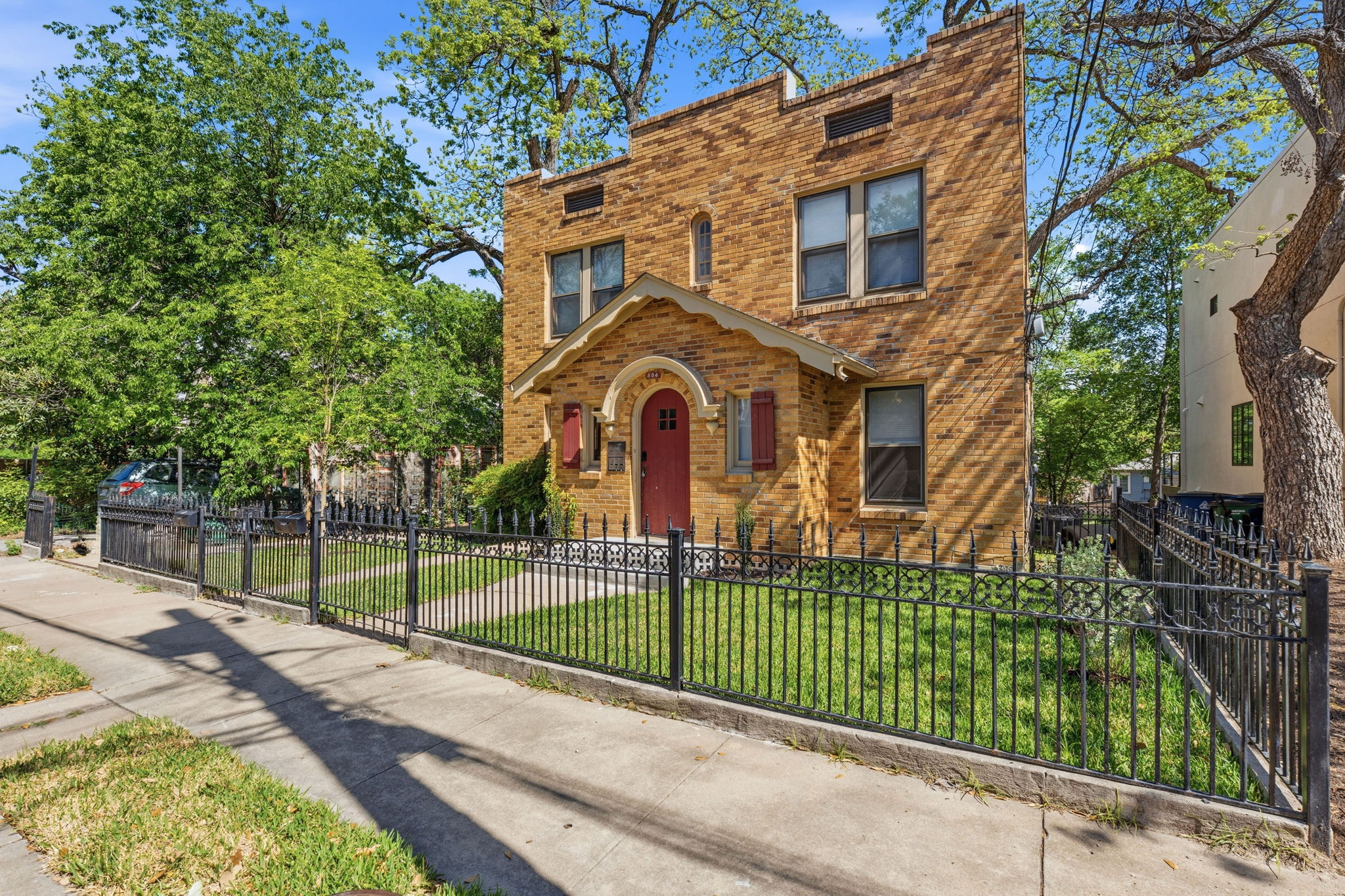 804 Rutherford Place, Unit A Austin, TX 78704 - Photo 2 of 17 a front view of a house with a garden