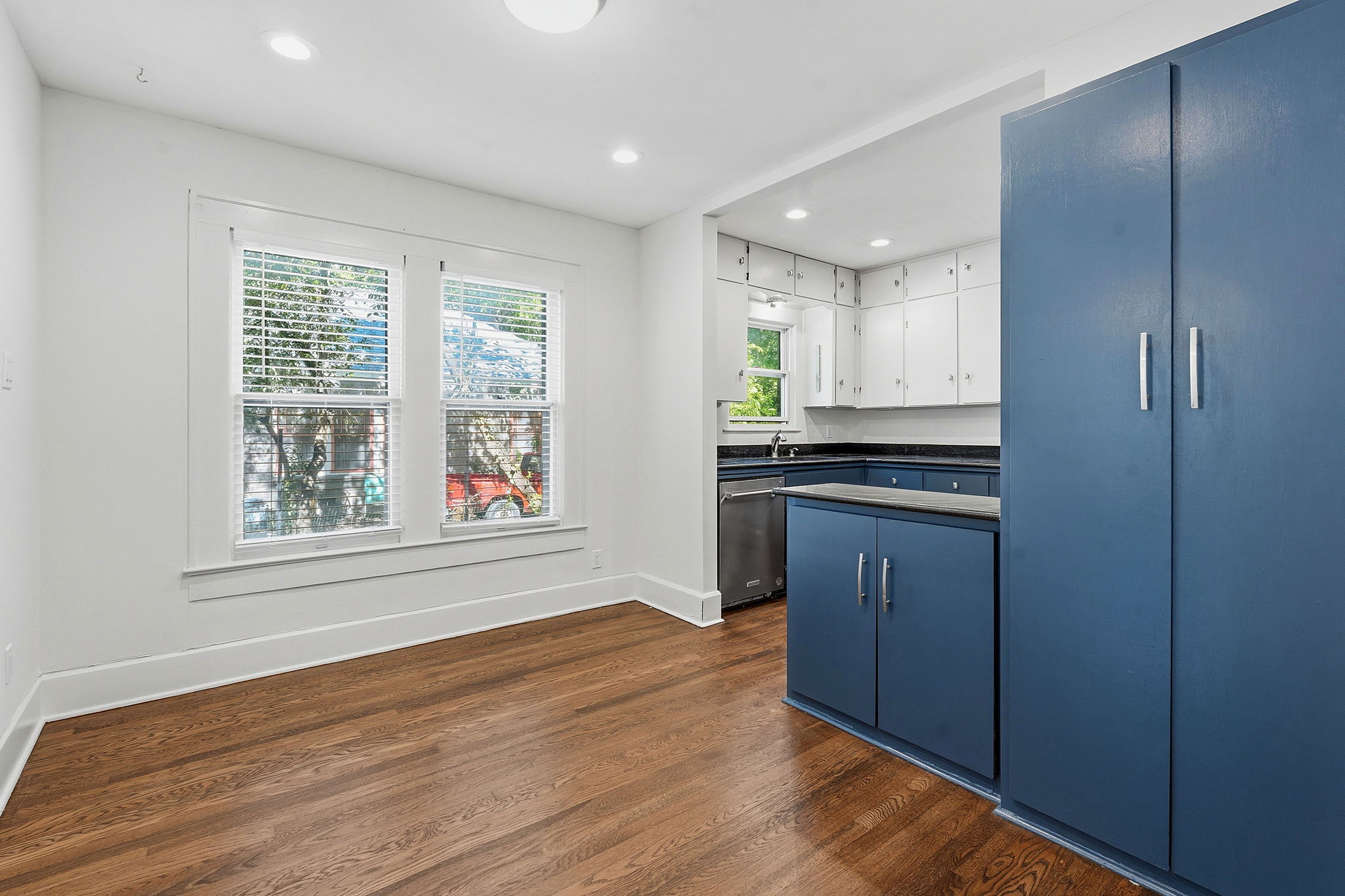 804 Rutherford Place, Unit A Austin, TX 78704 - Photo 5 of 17 a kitchen with stainless steel appliances granite countertop cabinets and window