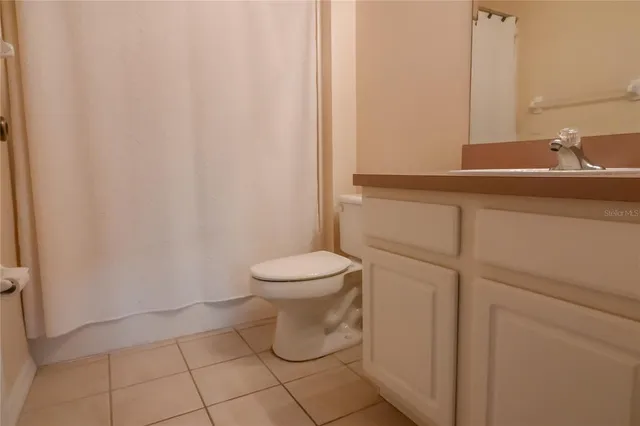 a bathroom with a toilet and a sink