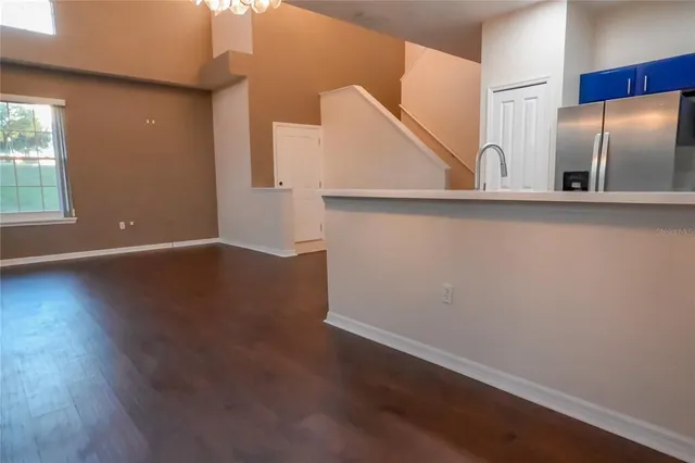 an entryway with wooden floor