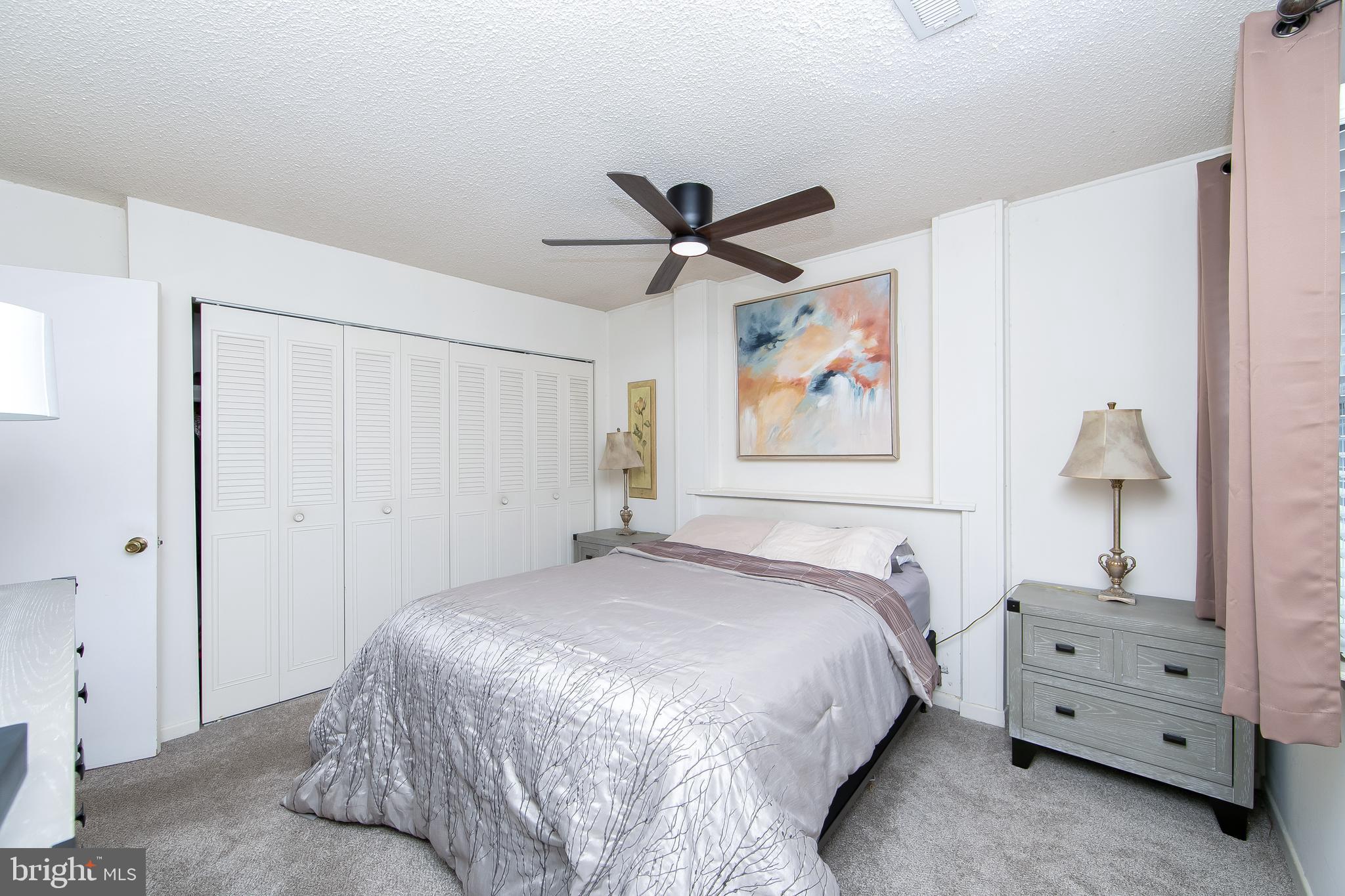 206 Winding Way Westville, NJ 08093 - Photo 11 of 20 a bedroom with a bed and a chandelier