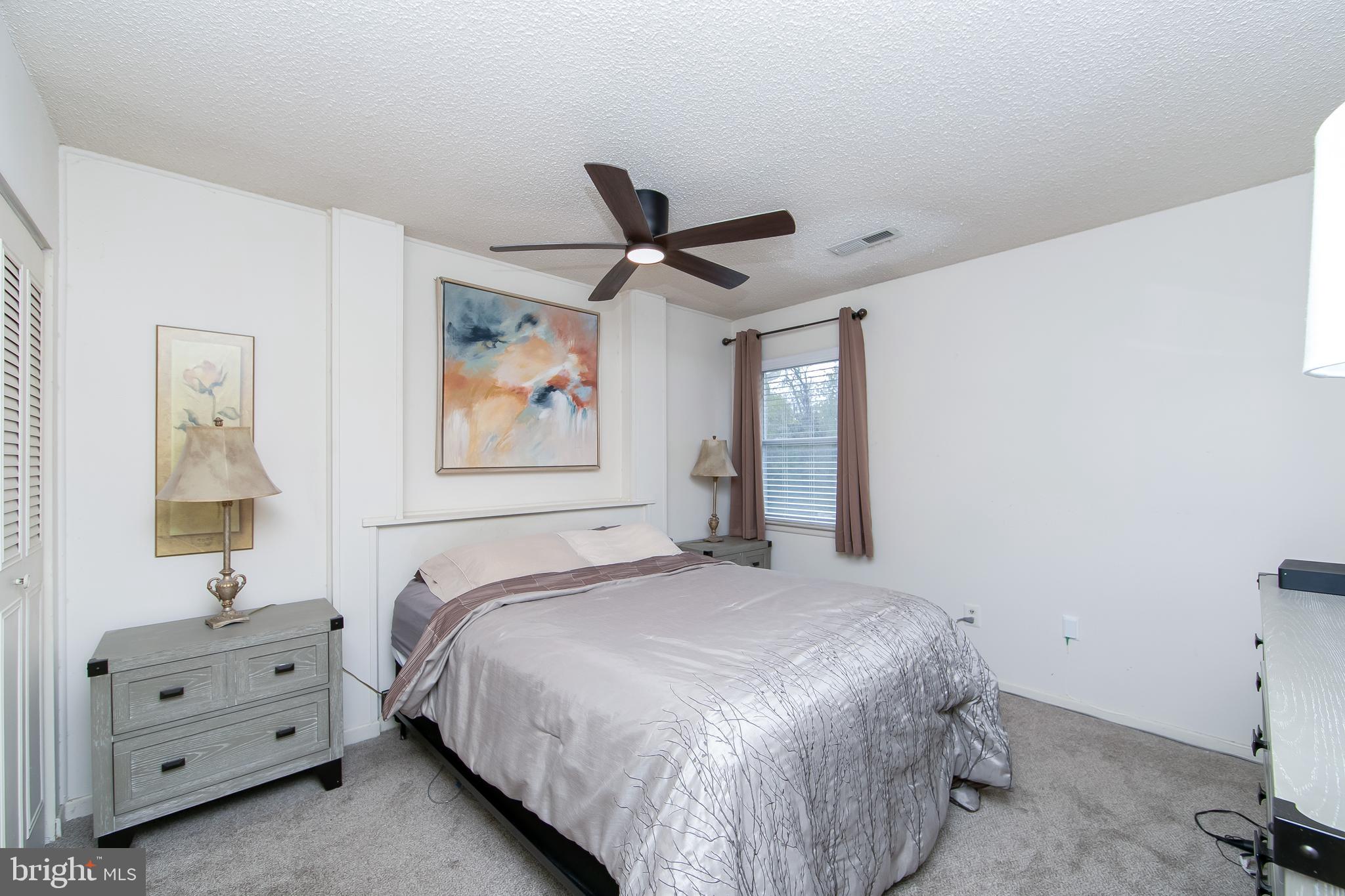 206 Winding Way Westville, NJ 08093 - Photo 12 of 20 a bedroom with a bed and a dresser