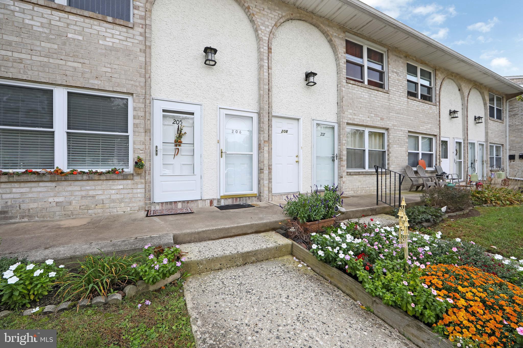 206 Winding Way Westville, NJ 08093 - Photo 19 of 20 a front view of a house with a garden