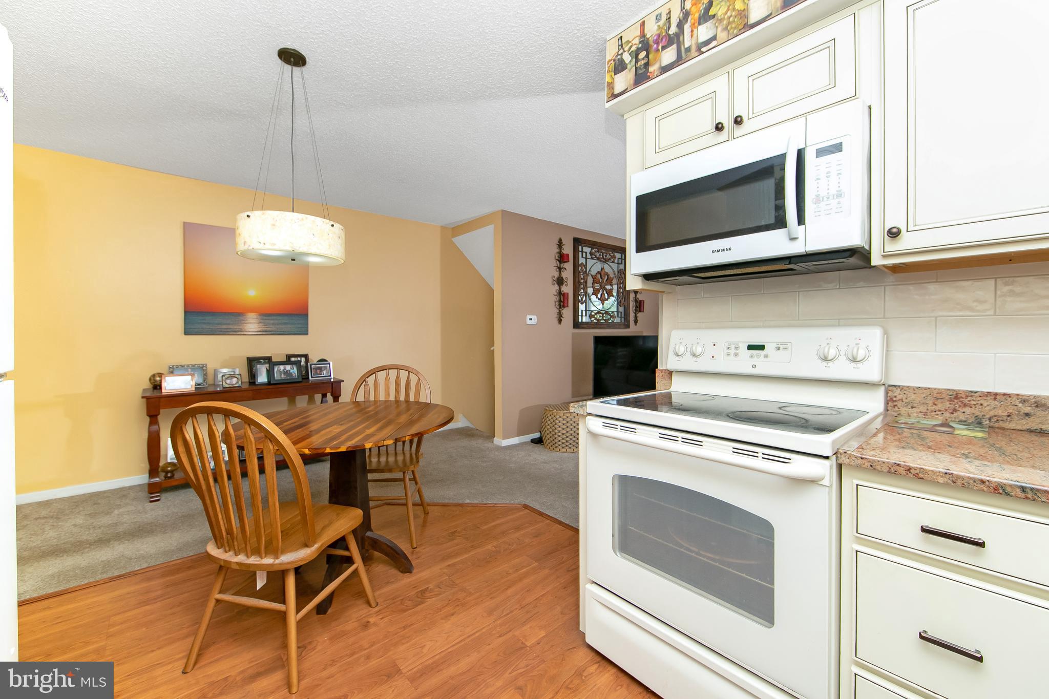 206 Winding Way Westville, NJ 08093 - Photo 9 of 20 a kitchen with a stove and a microwave