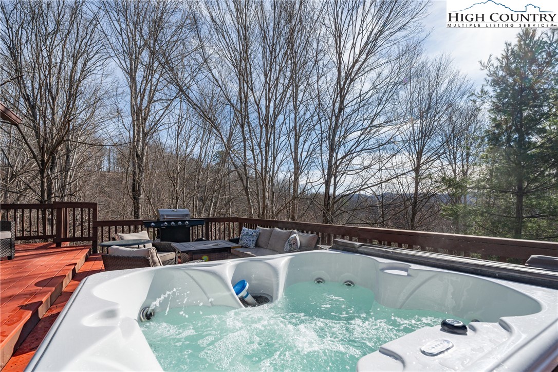 419 Billy Billings Road Vilas, NC 28692 - Photo 12 of 50 a view of a swimming pool with a sitting space