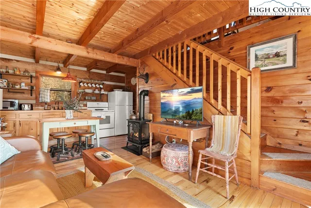 a bedroom with a bed next to a window