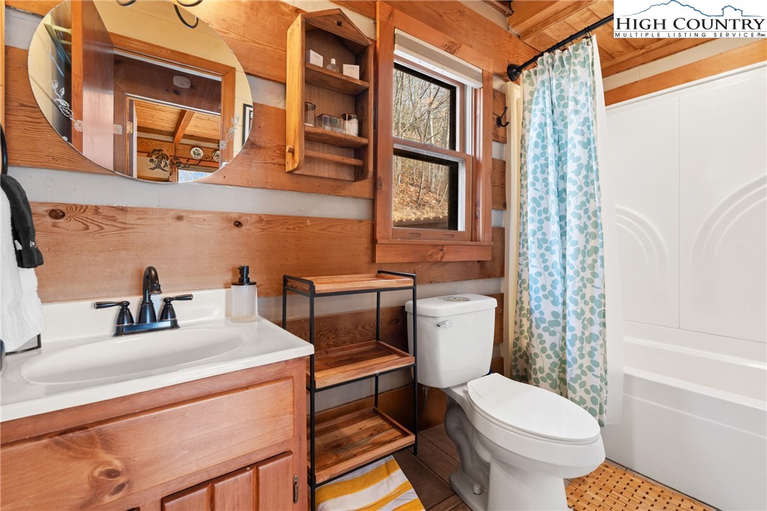419 Billy Billings Road Vilas, NC 28692 - Photo 34 of 50 a bathroom with a sink toilet vanity and shower