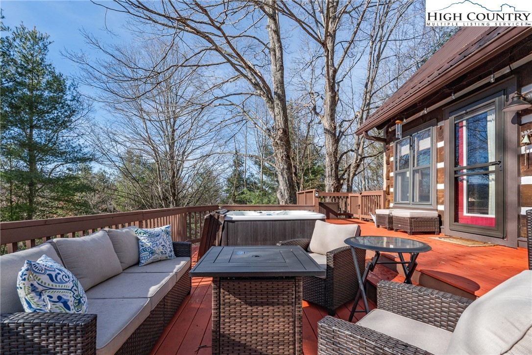 419 Billy Billings Road Vilas, NC 28692 - Photo 5 of 50 a backyard of a house with outdoor seating