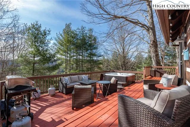 a view of a patio with couches table and chairs and potted plants