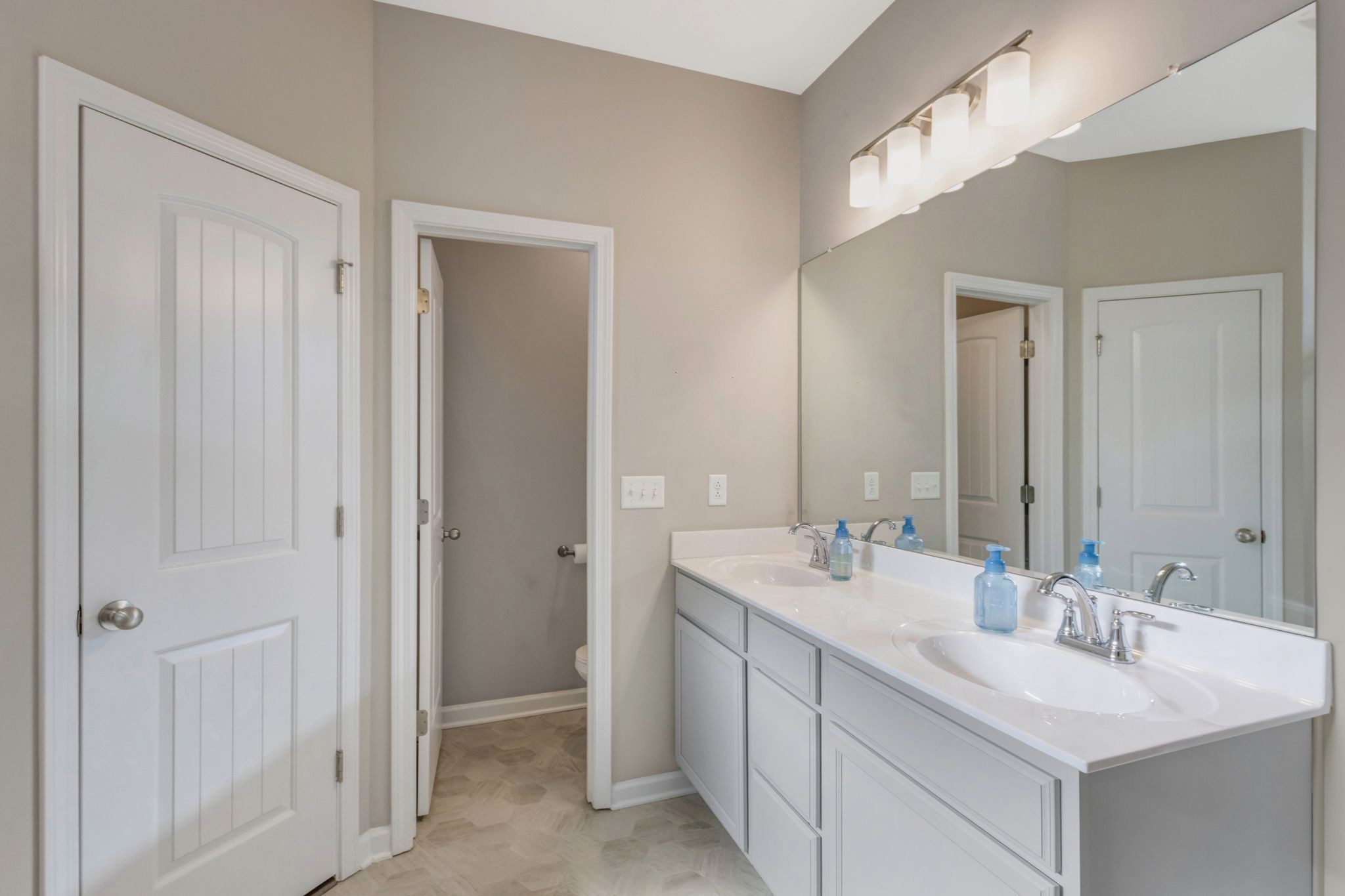 369 Ruby Cate Way Murfreesboro, TN 37128 - Photo 20 of 35 a bathroom with 2 sink and a mirror