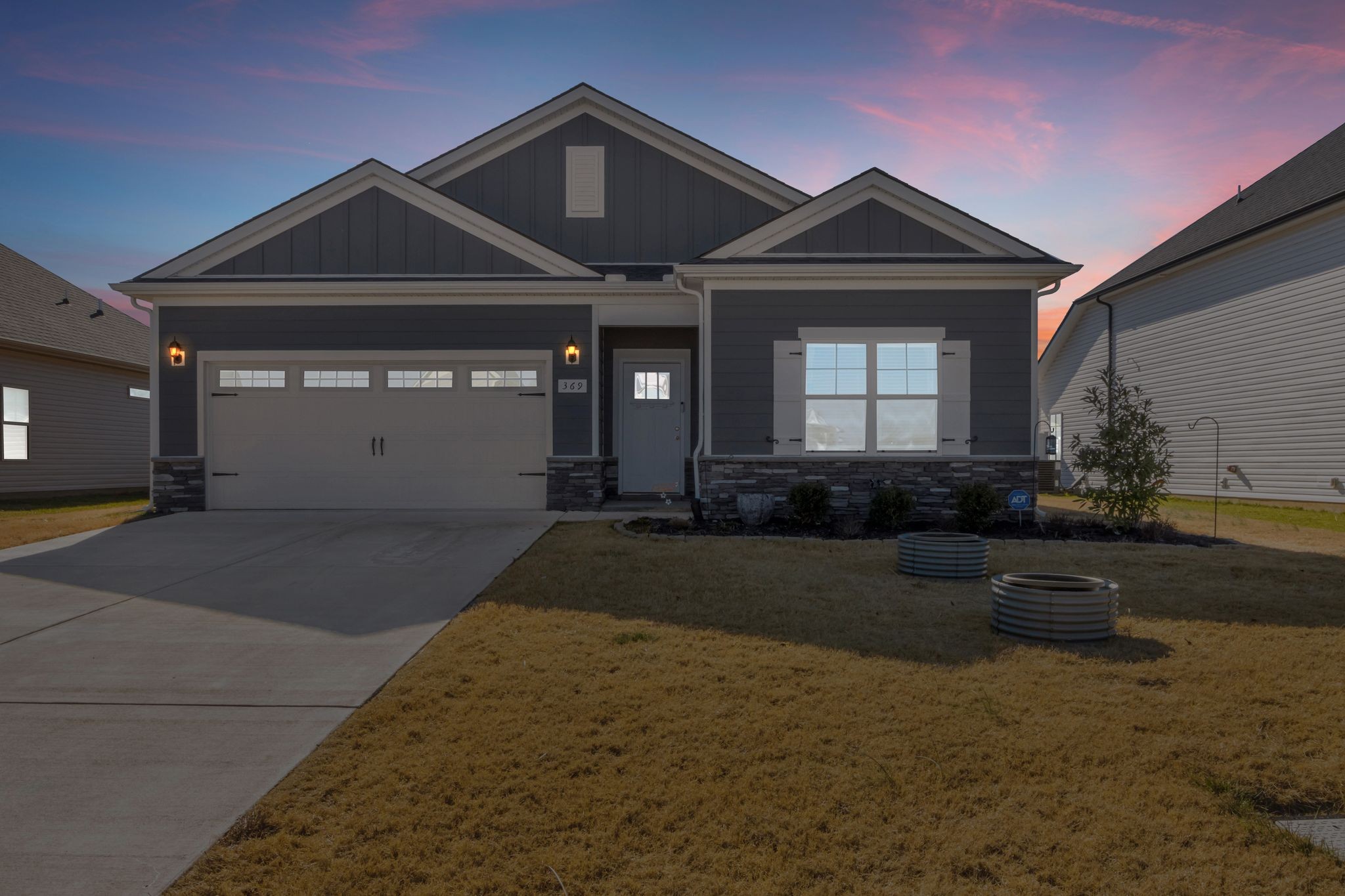 369 Ruby Cate Way Murfreesboro, TN 37128 - Photo 3 of 35 a front view of a house with a yard