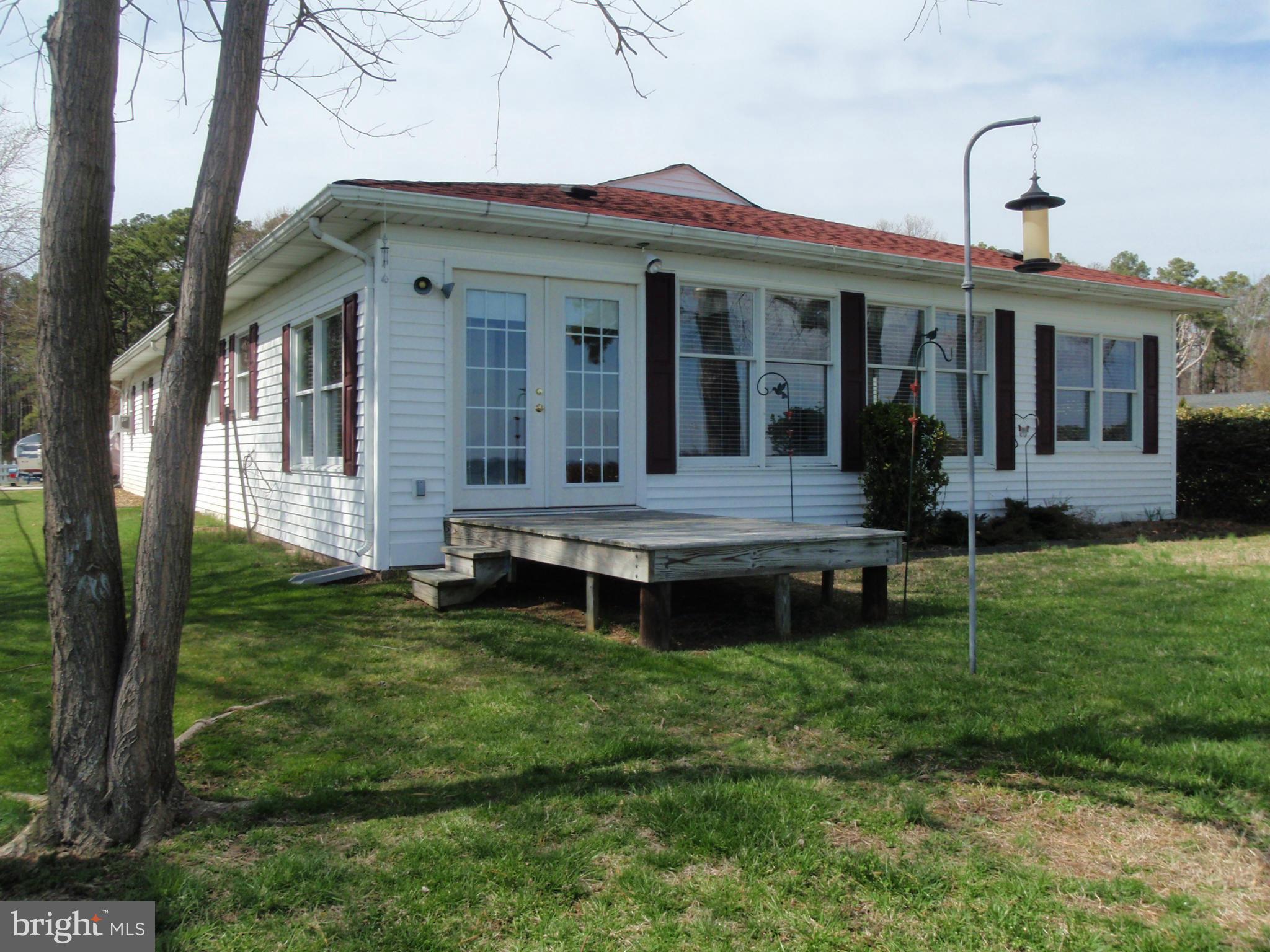 38431 Bayview Road Coltons Point, MD 20626 - Photo 2 of 25 a backyard of a house with table and chairs