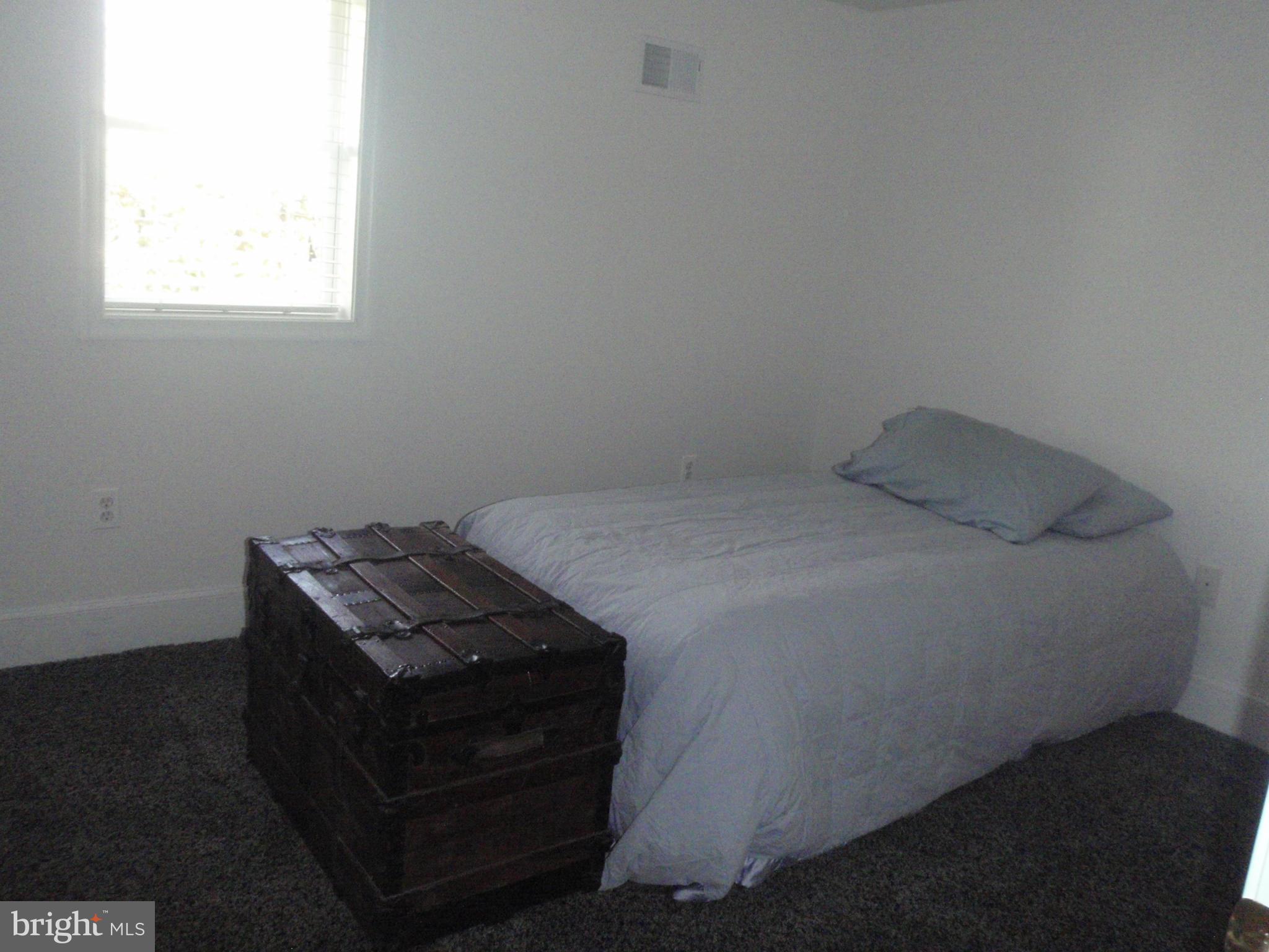 38431 Bayview Road Coltons Point, MD 20626 - Photo 11 of 25 a bedroom with a bed and a window