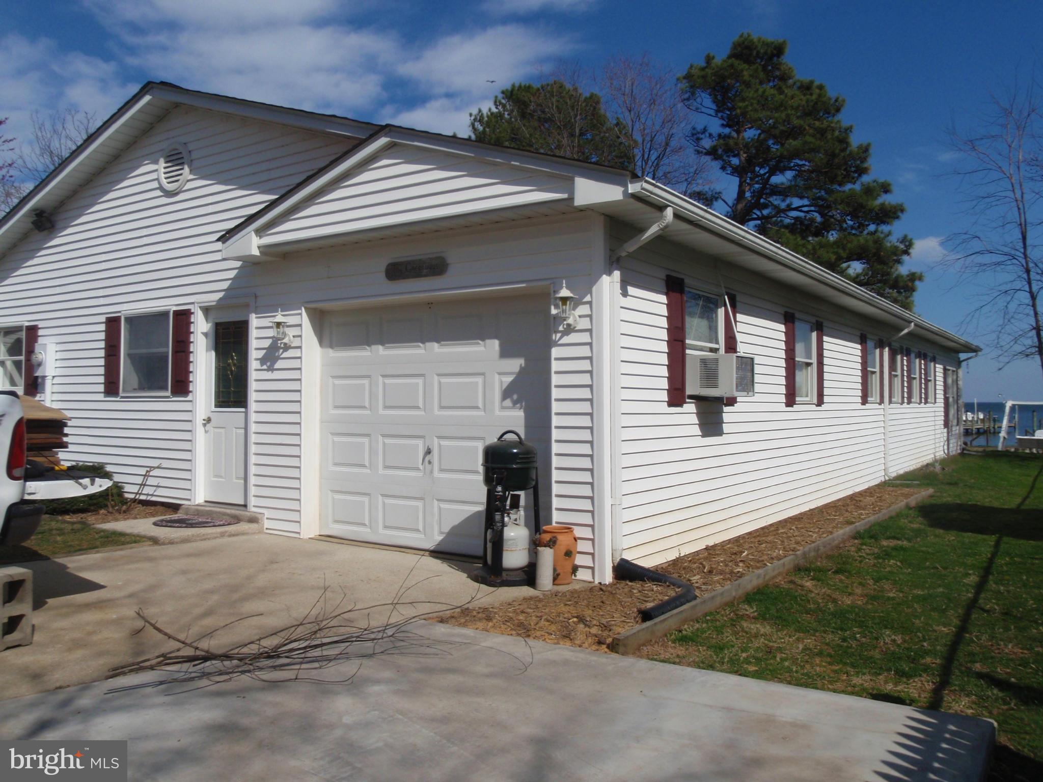 38431 Bayview Road Coltons Point, MD 20626 - Photo 20 of 25 a front view of a house with a yard