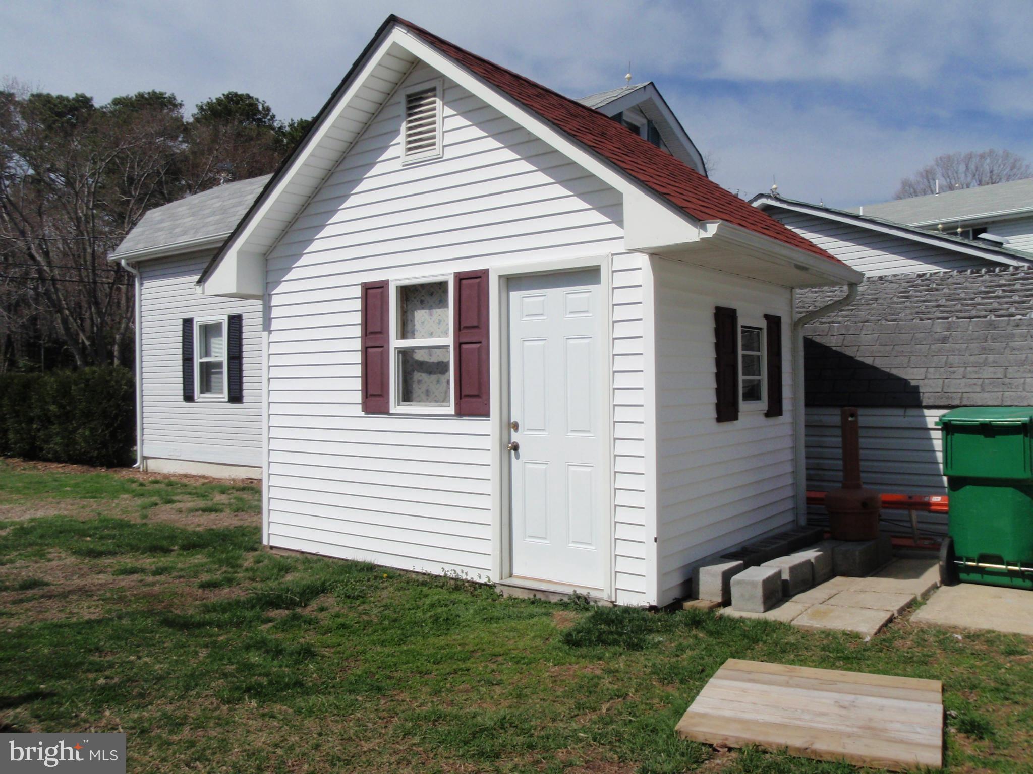 38431 Bayview Road Coltons Point, MD 20626 - Photo 21 of 25 a view of a white house next to a yard