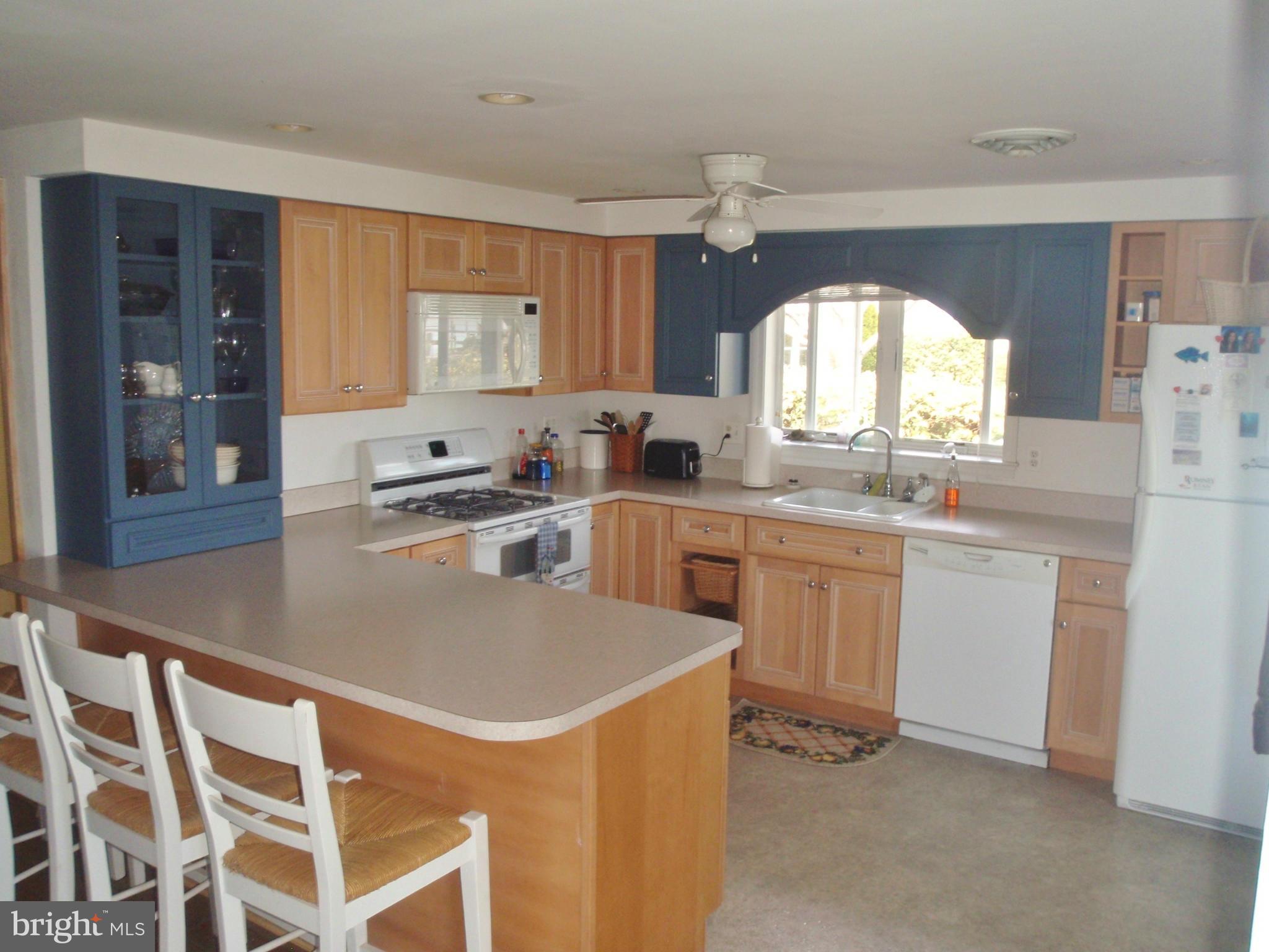 38431 Bayview Road Coltons Point, MD 20626 - Photo 4 of 25 a kitchen that has a sink and a stove in it