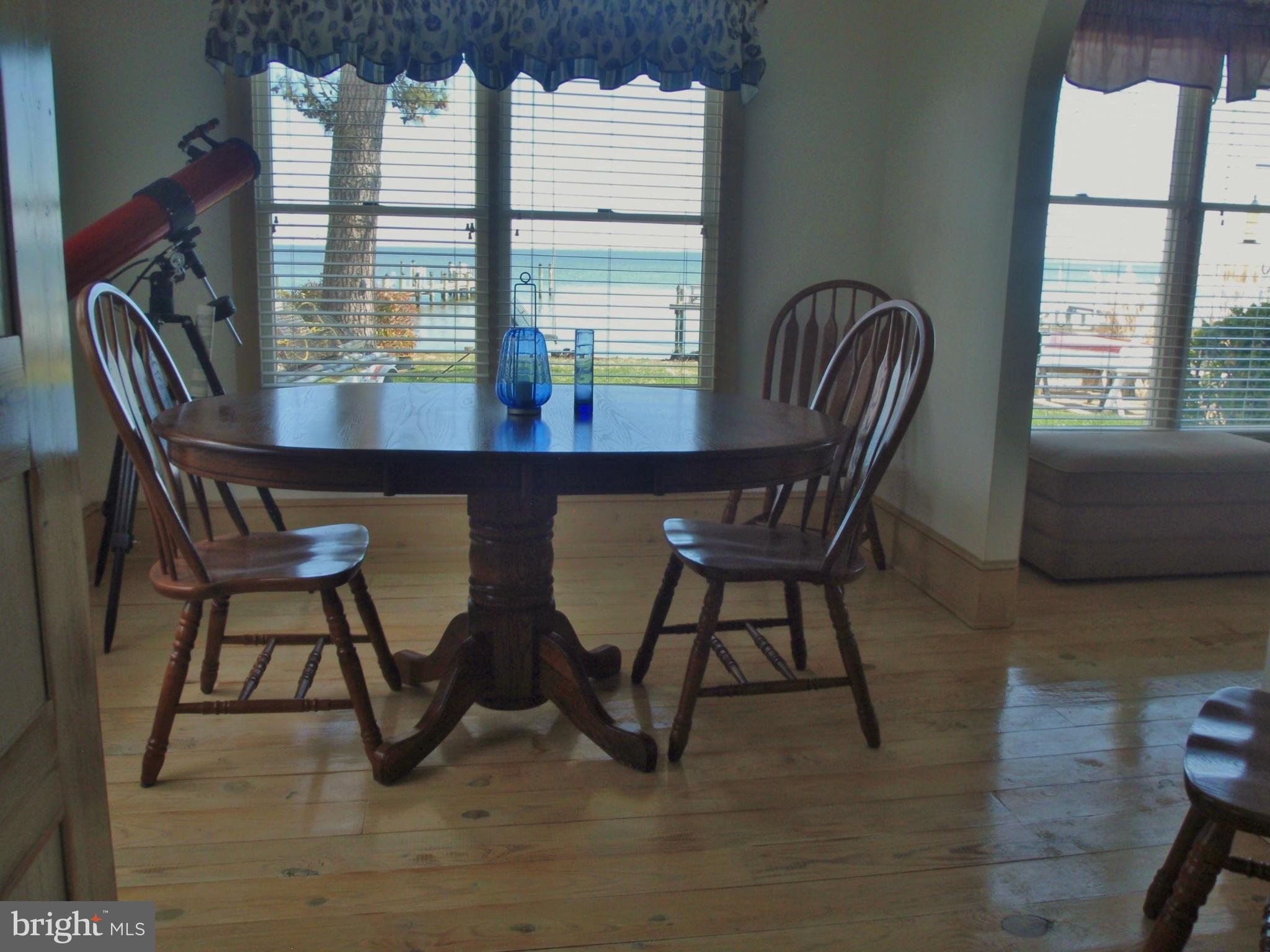 38431 Bayview Road Coltons Point, MD 20626 - Photo 6 of 25 a view of a dining room with furniture and window