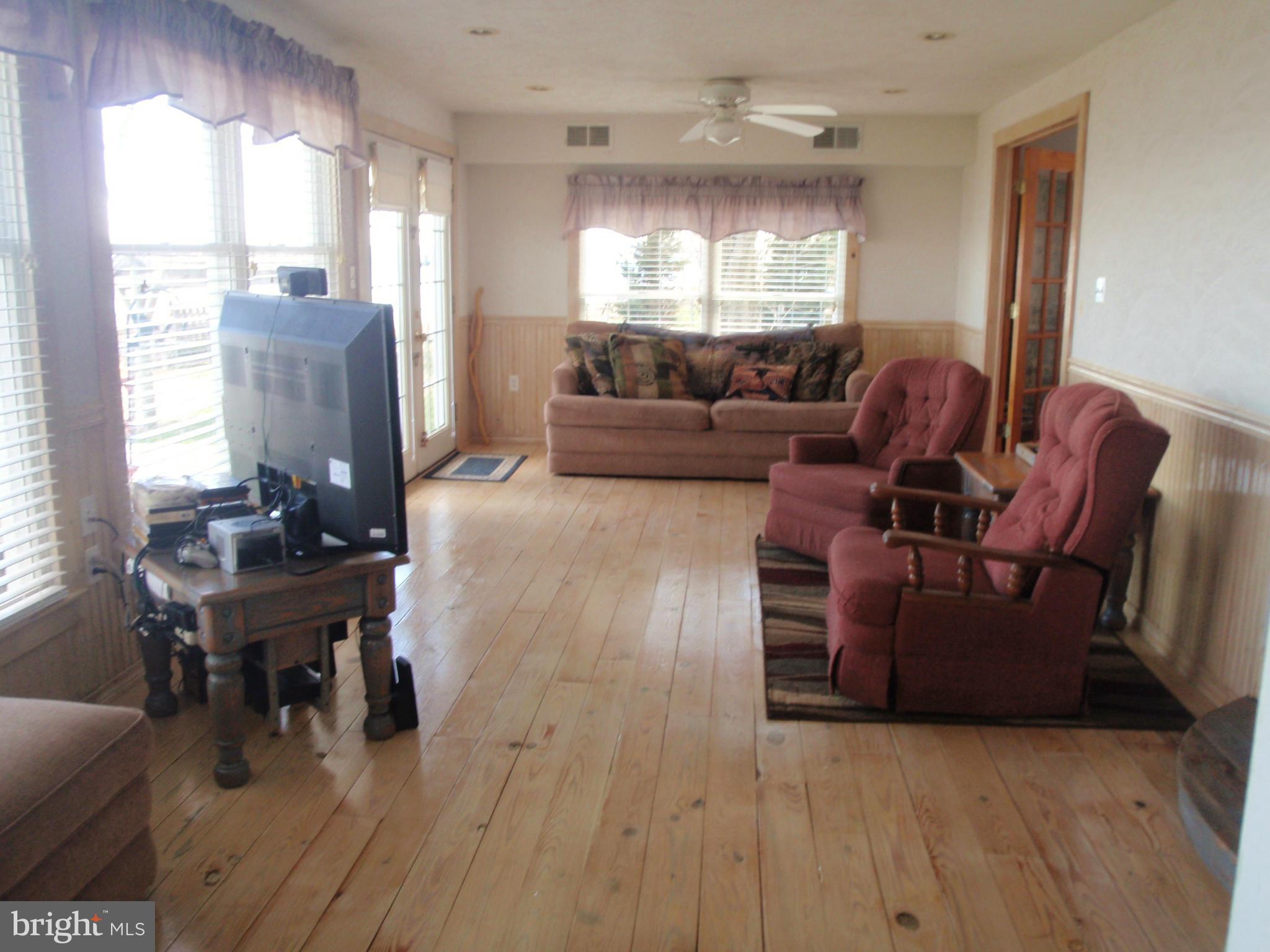 38431 Bayview Road Coltons Point, MD 20626 - Photo 8 of 25 a living room with furniture and a large window