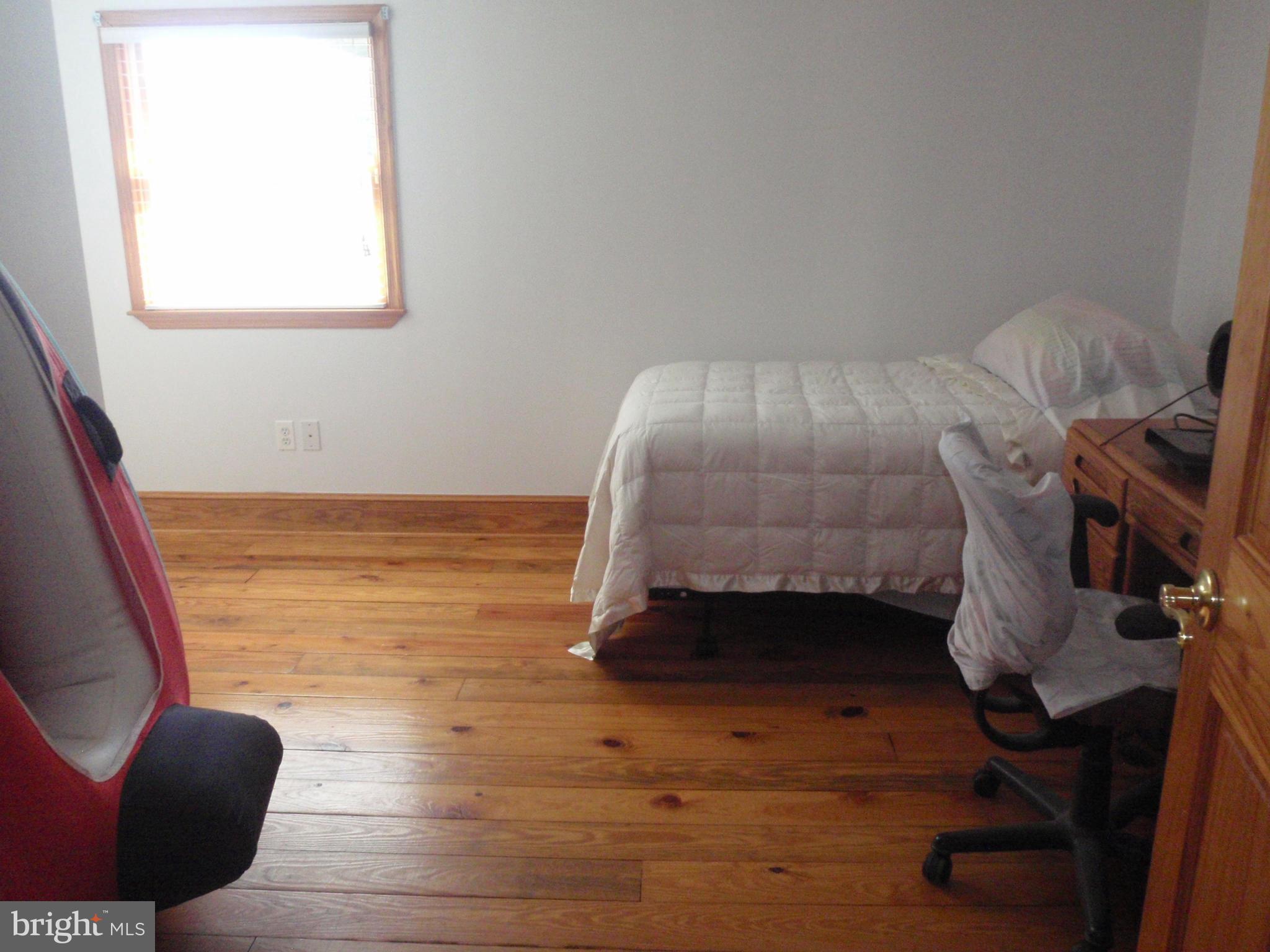 38431 Bayview Road Coltons Point, MD 20626 - Photo 10 of 25 a room with a bed and a chair