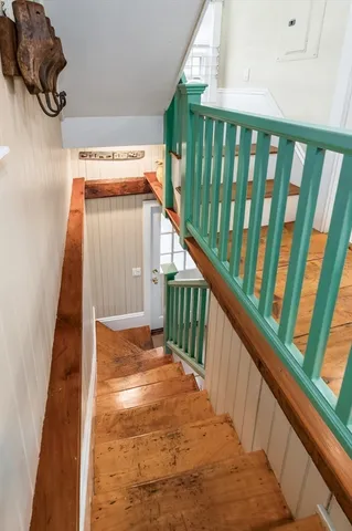 a bedroom with a couch and a large window