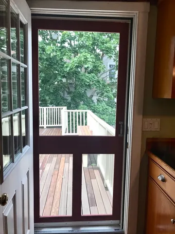 a view of balcony with wooden floor and fence