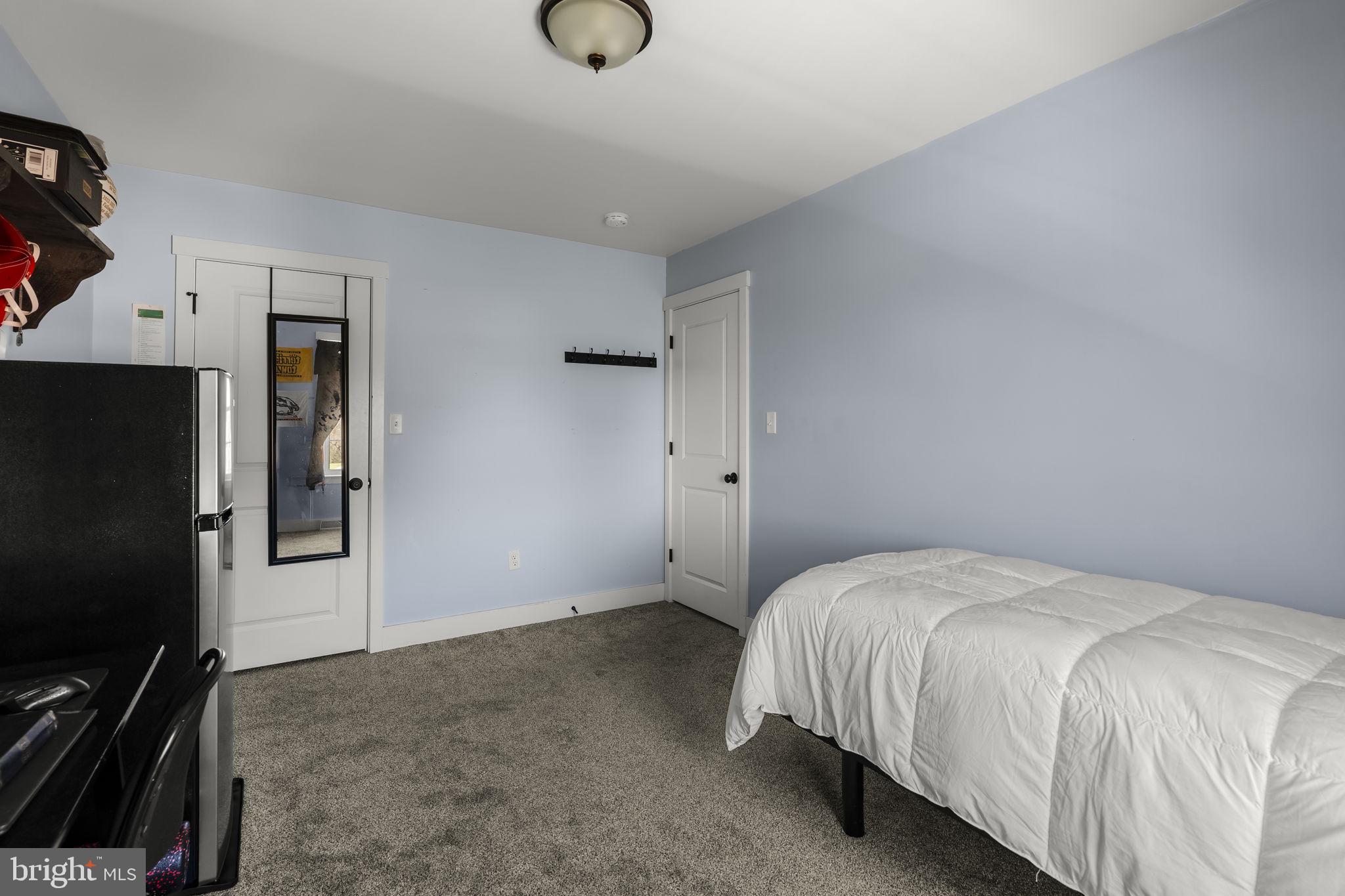 744 Lime Quarry Road Gap, PA 17527 - Photo 51 of 76 a bedroom with a bed and a flat screen tv