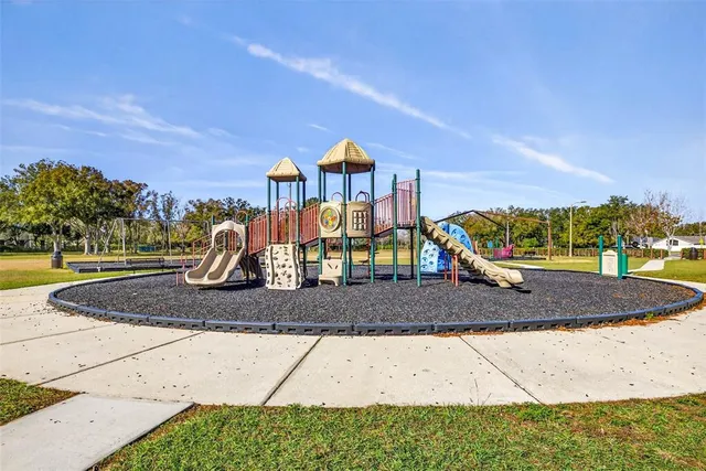 a view of a swimming pool with an outdoor seating and a garden