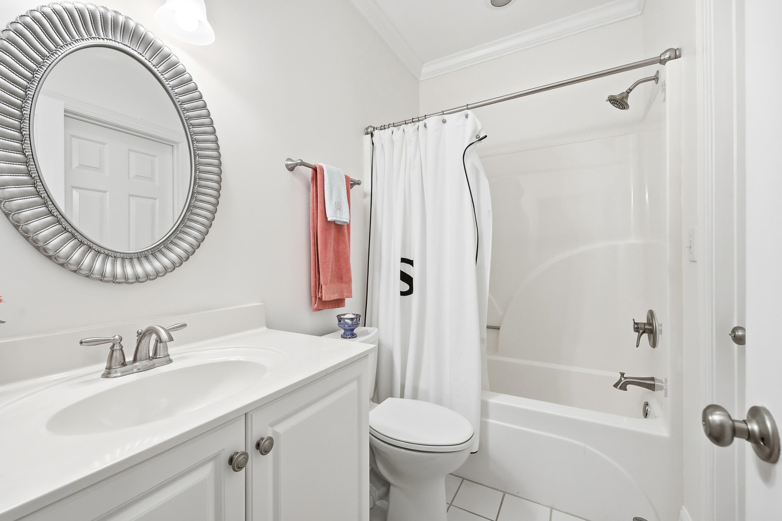 213 Old Carriage Loop Georgetown, SC 29440 - Photo 22 of 40 Full bath featuring vanity, shower / tub combo, crown molding, and tile patterned floors