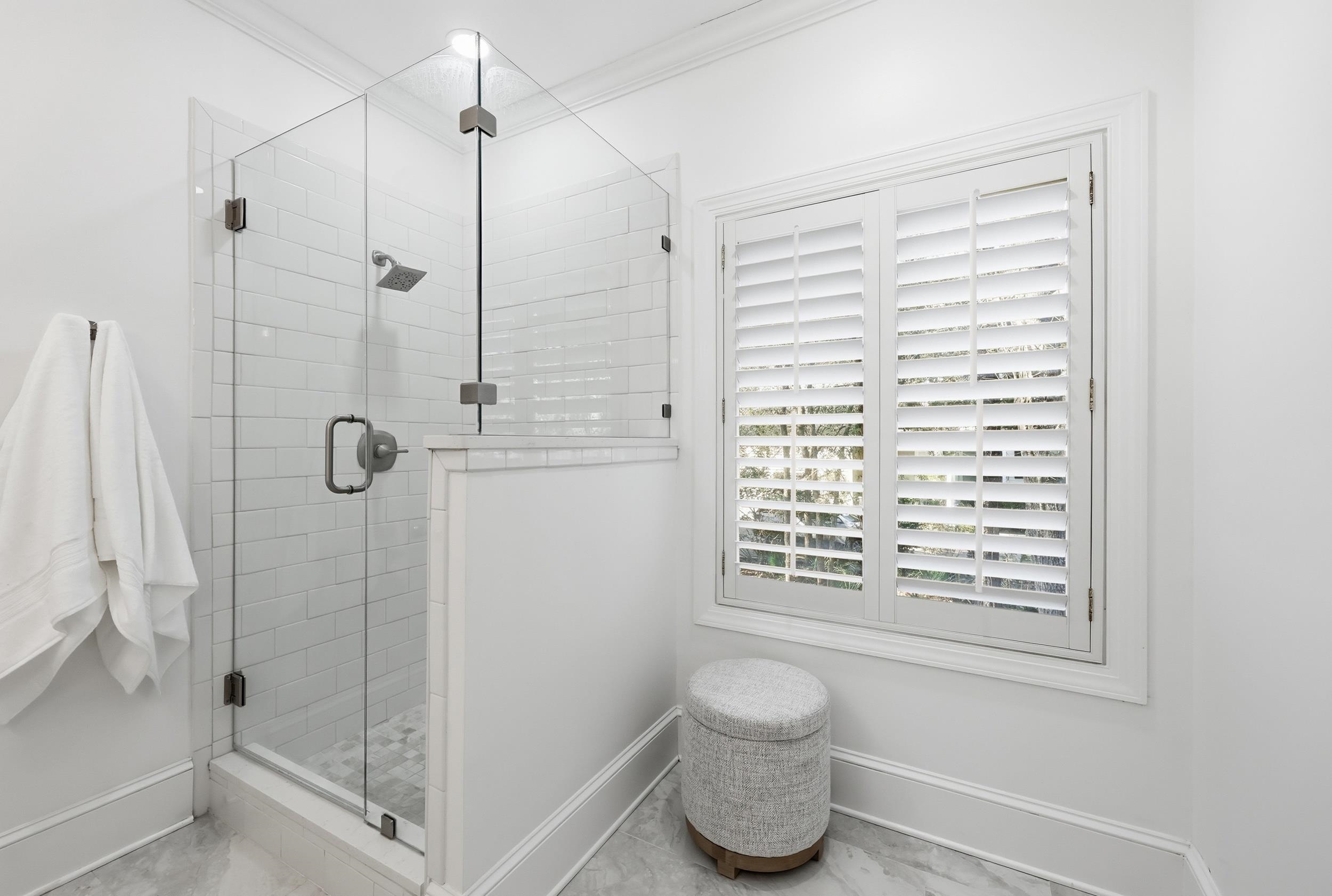 213 Old Carriage Loop Georgetown, SC 29440 - Photo 26 of 40 Bathroom featuring a stall shower, marble finish flooring, and crown molding