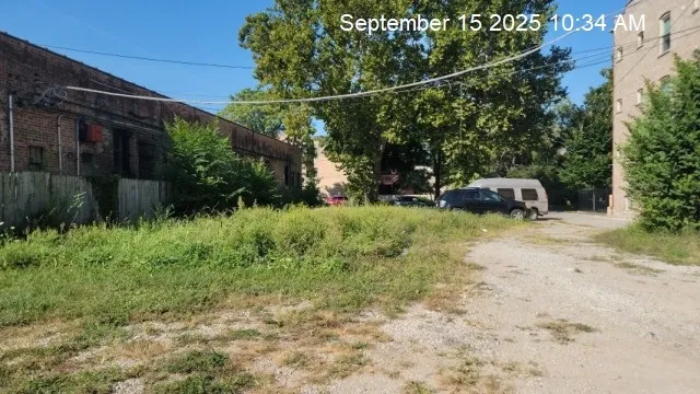 a backyard of a house with lots of green space and plants