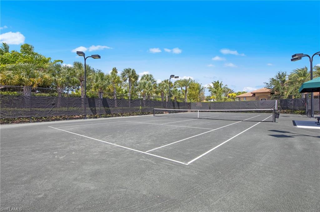 9366 Pocida Court, Unit 202 Naples, FL 34119 - Photo 42 of 44 a view of a tennis court