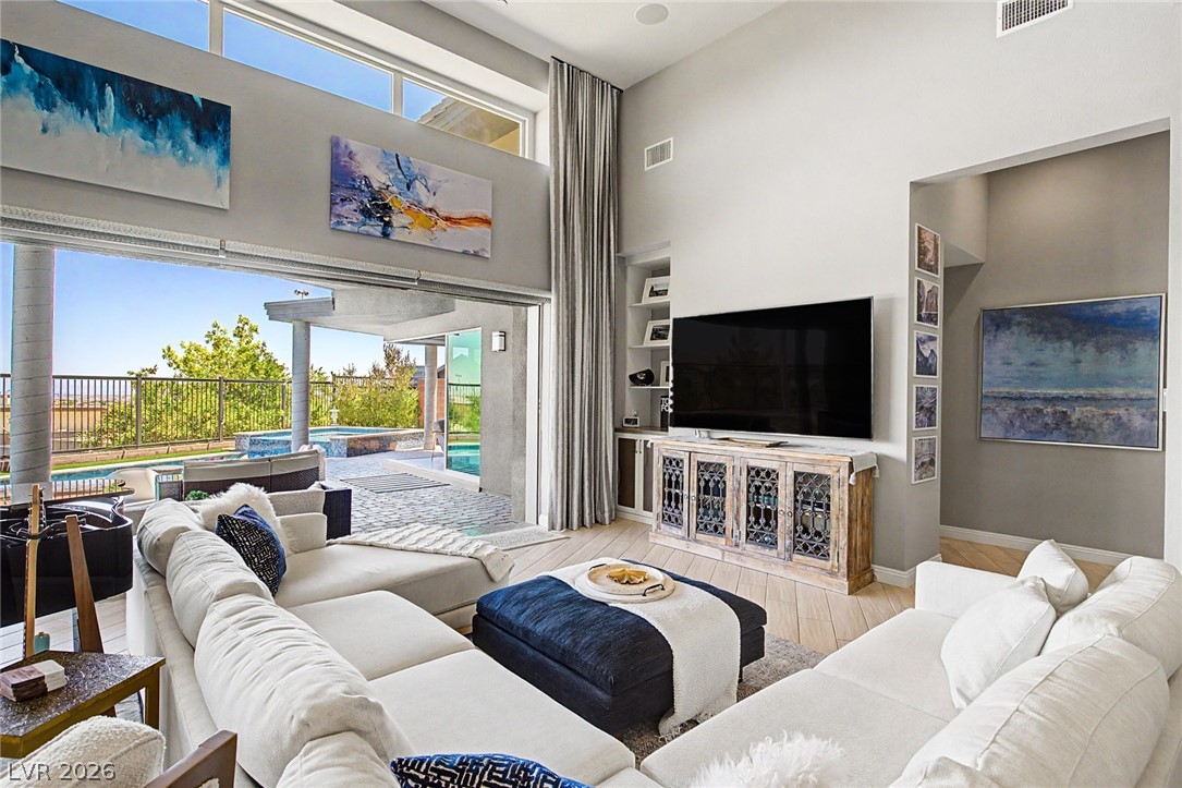6014 Willow Ridge Court Las Vegas, NV 89135 - Photo 20 of 99 This airy living space seamlessly connects to the outdoor oasis, offering serene views.