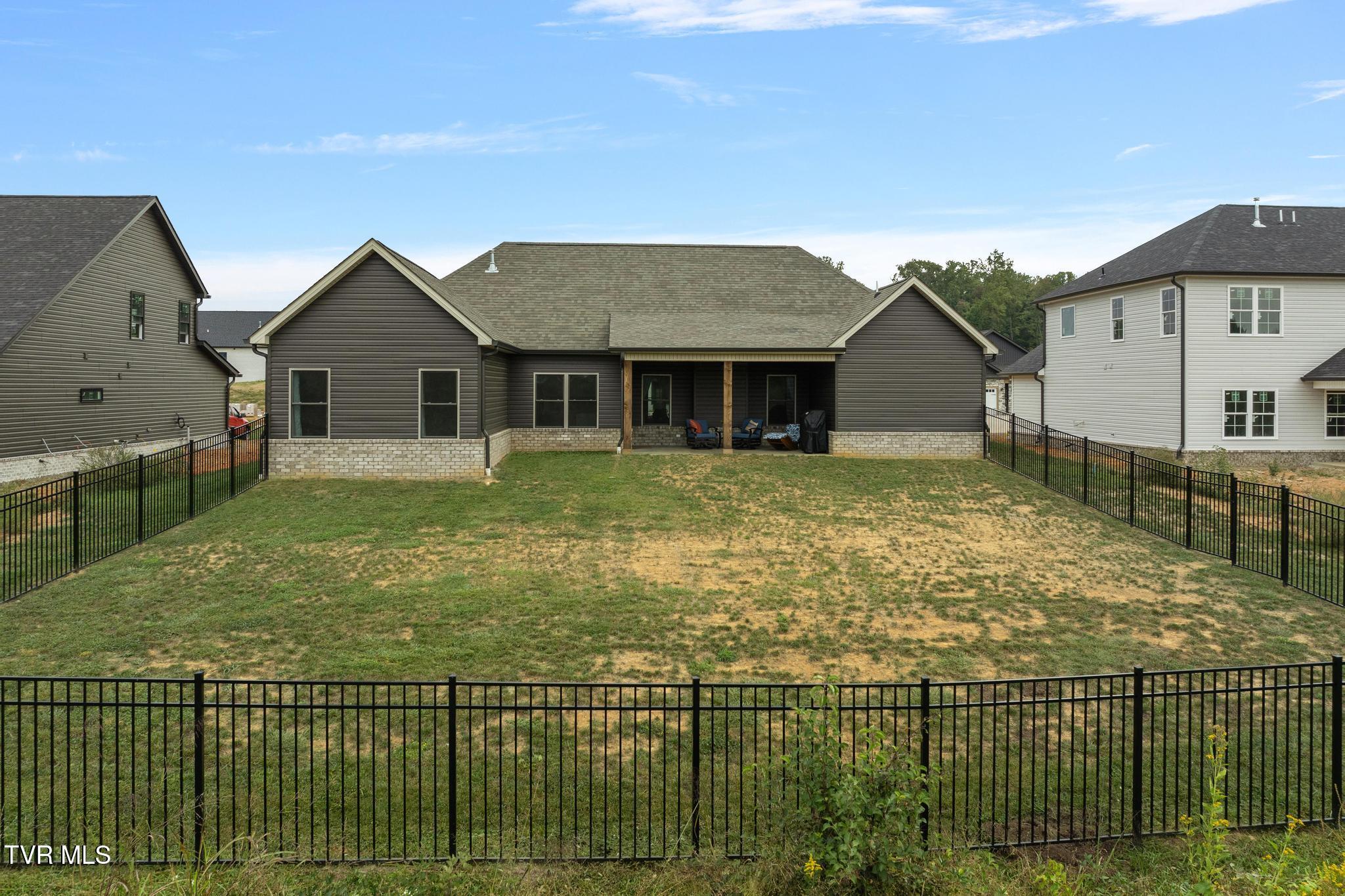 246 Ruby Rose Ridge Jonesborough, TN 37659 - Photo 35 of 41 Back view of home with fenced backyard