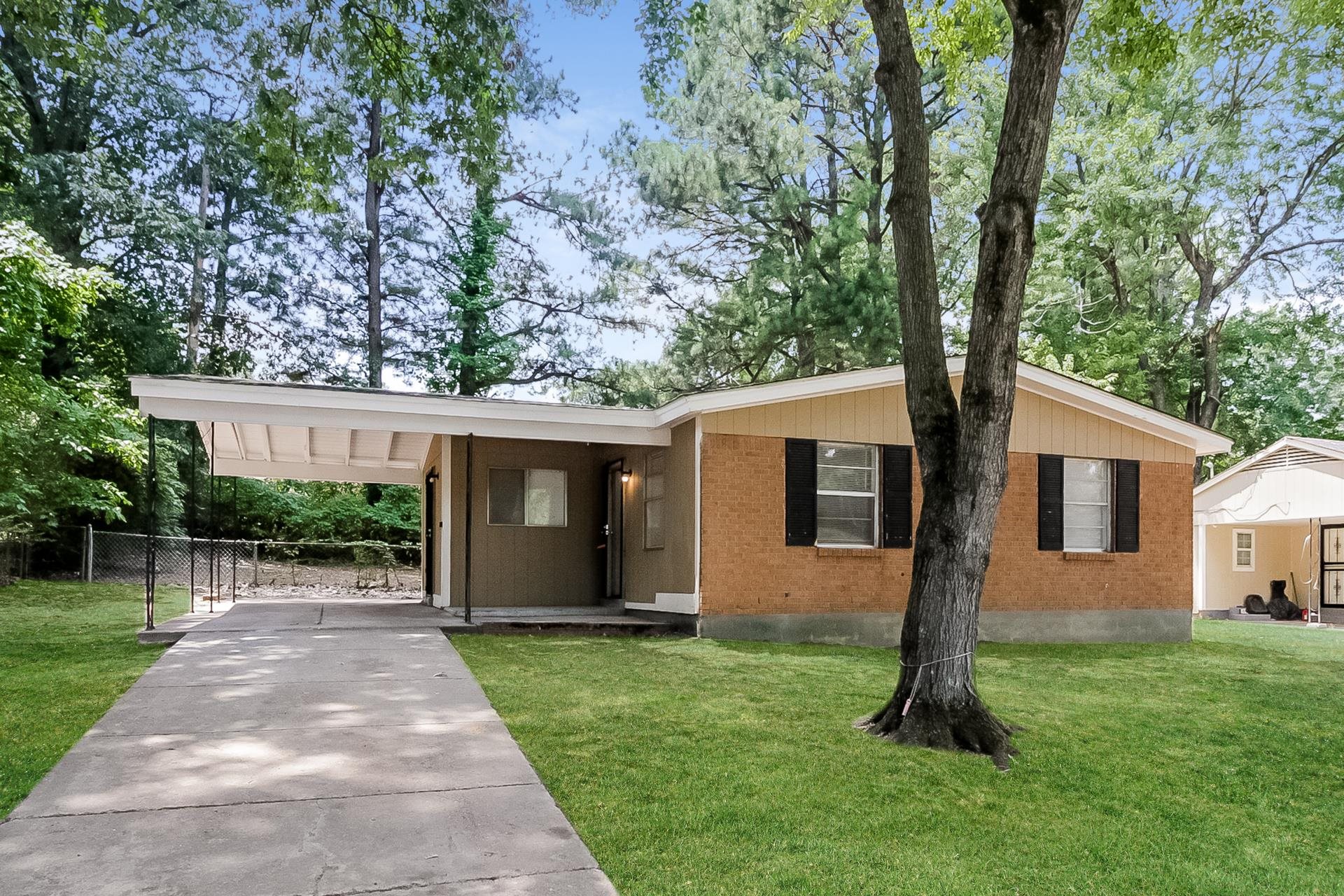 4217 Windermere Road Memphis, TN 38128 - Photo 1 of 15 a front view of house with yard and green space