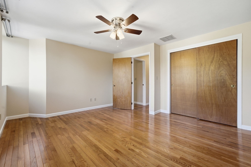30 Conant Street, Unit 3B Beverly, MA 01915 - Photo 19 of 30 a view of an empty room with wooden floor