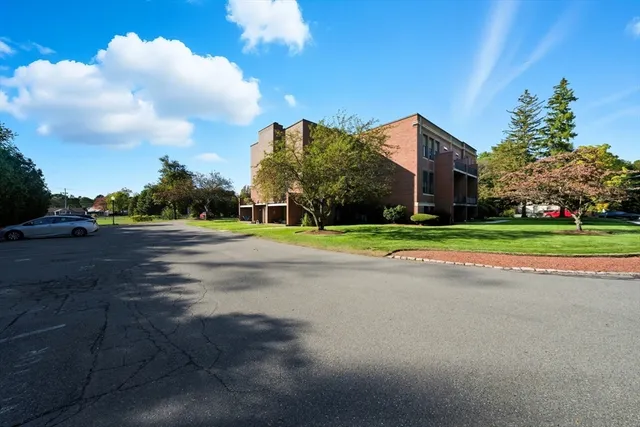 a brick building with a yard