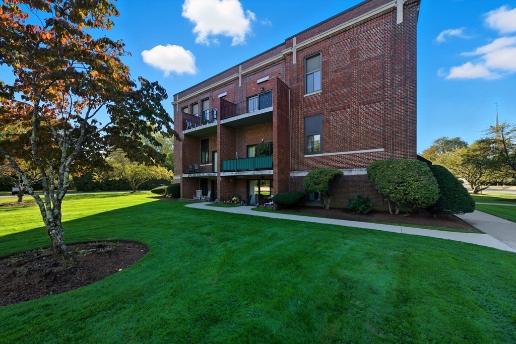 30 Conant Street, Unit 3B Beverly, MA 01915 - Photo 24 of 30 a brick building with a yard