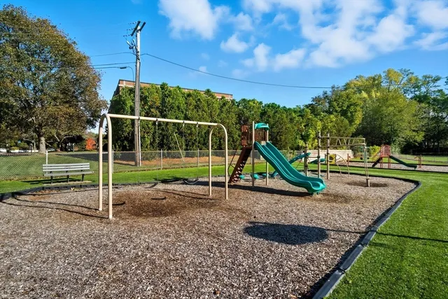 a front view of a brick house with a yard